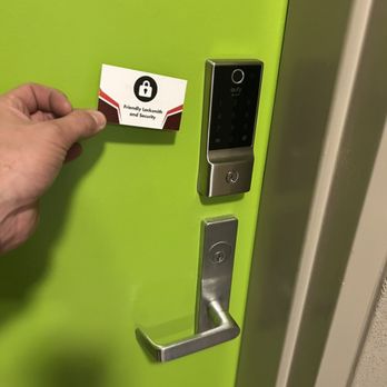 Keypad lock installed on a green door